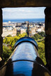 Vertical shot of a historic cannon on a battlement remained as decorations in Edinburgh castle