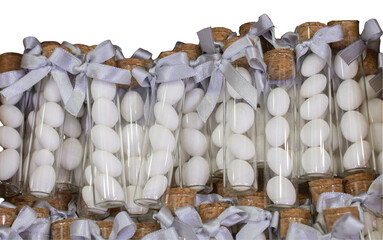 Canvas Print - Photo of long glass tube bottles of almond candy for weddings or engagements