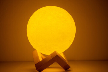 Wall Mural - moon lamp turn on in orange with white background