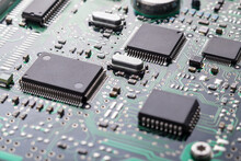 High Tech Technology Background With Printed Circuit Board PCB, Chips And Many Electronic Components, Selective Focus.