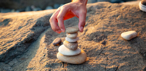 Canvas Print - Stack of stones on the sea beach