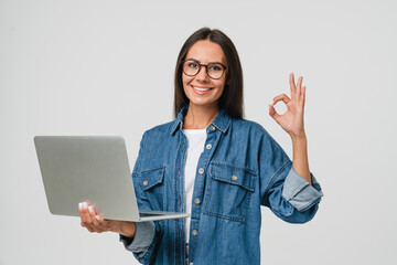 young smiling caucasian student freelancer woman using laptop for remote work, e-learning at univers