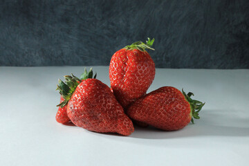 Closeup of strawberries on a white table