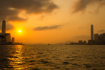 View of Victoria Harbor at sunset. Hong Kong.