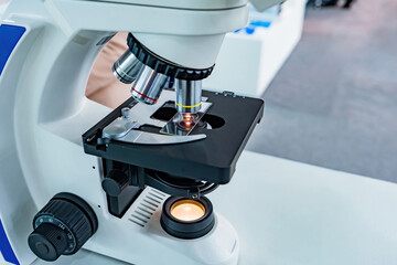 Poster - Electron microscope close up. Fragment of microscope with sample for research. Digital microscope with illumination. Equipment for scientific work concept. Use of scientific equipment