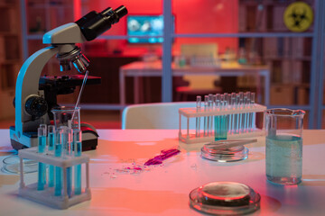 Poster - Broken flask containing liquid dangerous pathogen on workplace of modern scientist or virologist in clinic laboratory