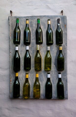 Poster - Vertical shot of wine bottles in concrete