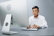 © SHOTPRIME STUDIO - worker sits at a computer in the office with a keyboard isolated background