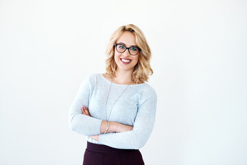 Poster - Every day is a chance to better on your potential. Studio portrait of a confident young businesswoman posing against a white background.