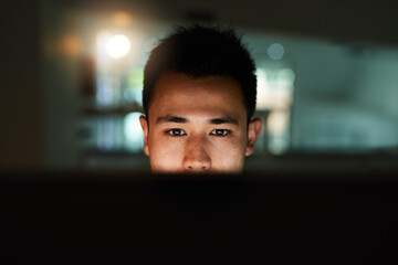 Poster - Late night work session. Shot of a handsome young male programmer working late in his office.
