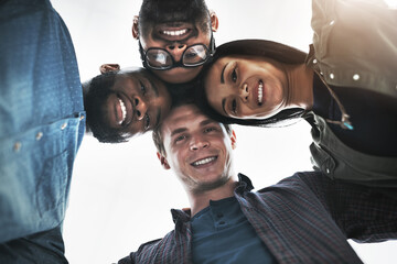 Canvas Print - Were looking down on everyone who doubted us. Low angle portrait of a group of young business people posing together in a modern office.