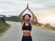 © Delmaine D/peopleimages.com - Finding balance. Cropped shot of an attractive young sportswoman meditating during her workout outdoors.