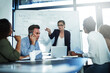 © Thurstan H/peopleimages.com - What was your input in this project. Shot of a stressed businesswoman losing her temper during a meeting with her colleagues in the boardroom.
