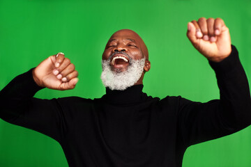 Poster - Im living my best life. Cropped shot of a senior man dancing against a green background.