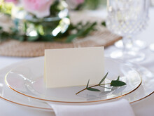 Mockup White Blank Space Card, For Name Place, Folded, Greeting, Invitation On Wedding Table Setting Background. With Clipping Path