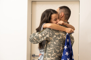 Wall Mural - Veteran soldier comes back to his family from the military.