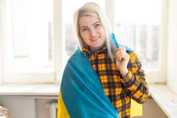 woman with Ukraine flag. Stop war between Russia and Ukraine. Stay with Ukraine. Pray and hope for peace and world. Copy space