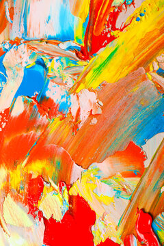 Wall Mural - Closeup view of artist's palette with mixed bright paints as background
