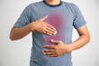 Man with acid reflux on white background, health care and diet concept.