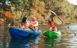 © _KUBE_ - Kayaking at th river. A group of happy friends are high five sitting in kayaks. World Tourism Day concept