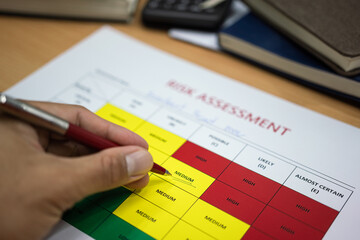 Wall Mural - action of a manager is using ballpoint pen to evaluate 