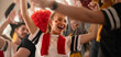 © Halfpoint - German football fans celebrating their team's victory at stadium.