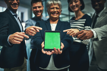 Poster - Its all happening online. Shot of a group of businesspeople pointing to a digital tablet with a chroma key screen.