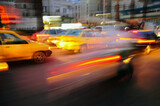 Fototapeta  - blurred background with light of taxi and cars driving on road at night with speed motion