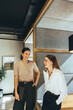 © Jacob Lund - Businesswomen sharing a laugh in the office