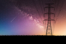 High Voltage Power Transmission Towers Have A Complex Steel Structure In The Evening. High-voltage Power Lines At Sunset,high Voltage Electric Transmission Tower