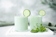 chilled cucumber and microgreen soup in large glasses