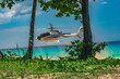 Air taxi to the beach, helicopter landing by the ocean