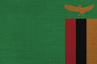 Patriotic textile background in colors of national flag. Zambia