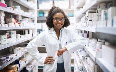 Poster - We have everything you need. Cropped portrait of an attractive young female pharmacist working in a pharmacy.