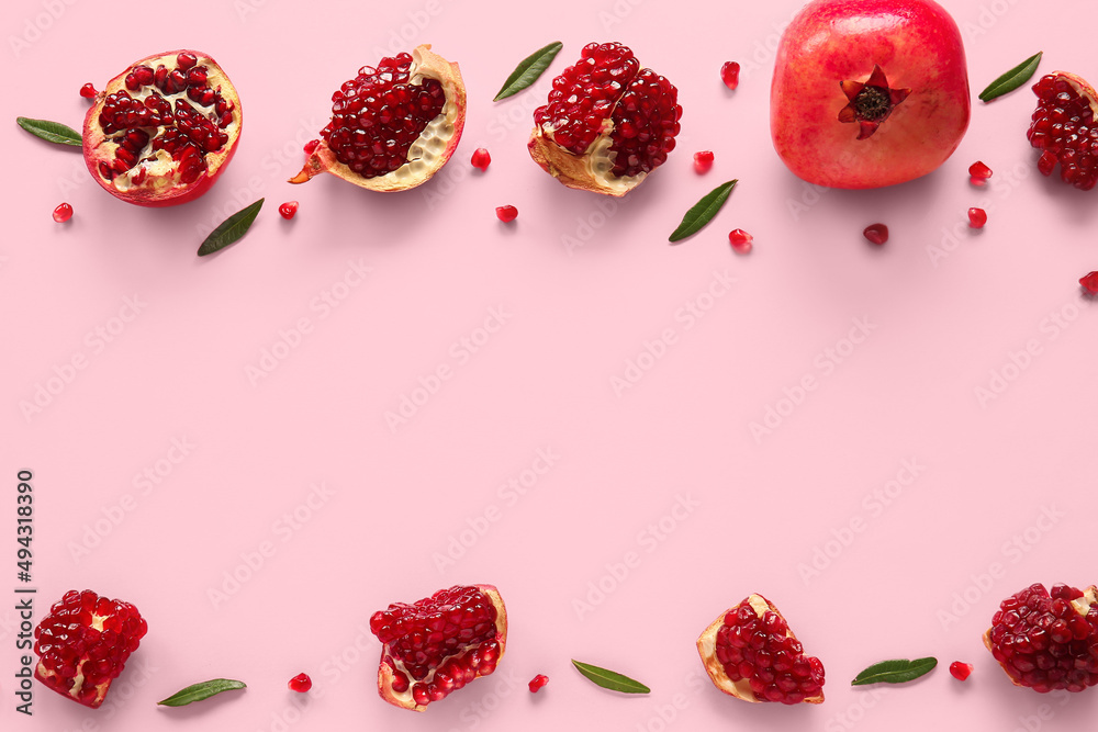 Tasty ripe pomegranate pieces on pink background
