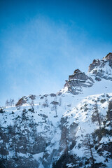 Poster - Vertical low angle shot of snowy mountain high in the winter