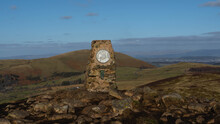 View Of The Gowbarrow Fell Summit Trig Point With The Hills On The Background