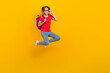 © deagreez - Full size photo of young cheerful lady hold backpack eyewear lesson jumper isolated over yellow color background