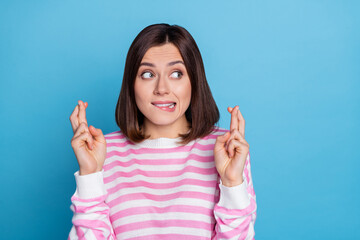 Canvas Print - Photo of worried millennial bob hairdo lady crossed fingers wear striped shirt isolated on blue color background