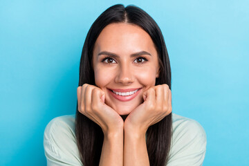 Sticker - Photo of young adorable woman good mood hands touch cheeks dream isolated over blue color background