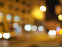 Bokeh Filter Background With Brown Lights Against An Out Of Focus Street