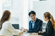 © PaeGAG - Group of asian young modern people in smart casual wear having a brainstorm meeting while sitting in office background. Business meeting, Planning, Strategy, New business development, Startup concept.