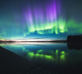 Sticker - Scenic view of a wooden dock under a beautiful Aurora Borealis