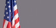 © meeboonstudio - lose-up of the American flag is on the left side on a gray background