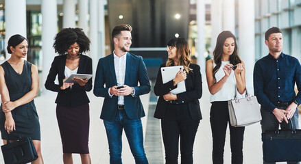 Aufkleber - What are we waiting for. Shot of a group of confident young businesspeople standing in a row next to each other inside of the office during the day.