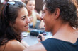 © Marine Gastineau/peopleimages.com - Hes such a charmer. Young teen couple sharing a romantic moment while out with their friends.