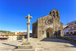 Betanzos old town Galicia Spain. View of Santa María de Azougue Parish Church and a traditional stone cross knows as Cruceiro
