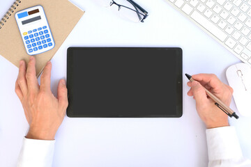Poster - Tablet on the desk office and technology, Top view on working space with office equipment and space for text