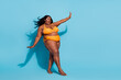 Full length body size view of attractive cheery funny woman dancing posing having fun isolated over bright blue color background