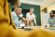 © Jacob Lund - Female entrepreneur leading a meeting in a boardroom